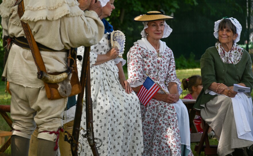 Judith Olaviany, Sherry Emershaw and Doris Magee, members of the 24th Connecticut Militia Regiment, participate in the annual commemorative service at the Wyoming Monument.