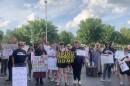 About 100 protesters rallied outside of U.S. Rep. Brett Guthrie's Bowling Green office on June 20, 2025, demanding the lawmaker intervene in the case of Ernesto Manuel Andres.