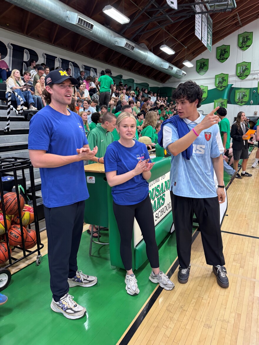 Christopher Schwarzenegger (left) helped coach one of the teams; his grandmother Eunice Shriver founded the Special Olympics, and actor Charles Melton (right) coached the home team.
