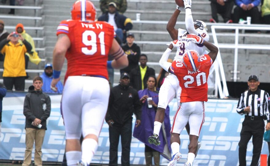 ECU wide receiver Cam Worthy catches a touchdown pass early in the third quarter. Florida defensive back Marcus Maye with the coverage.