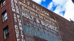 The restored Holt & Bugbee lumber company sign in the West End of Boston. (Jesse Costa/WBUR)