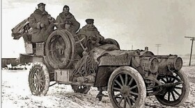 A black and white portrait of an old car called the Flyer.