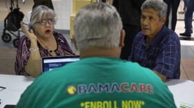 Isabel Diaz Tinoco (left) and Jose Luis Tinoco speak with Otto Hernandez, an insurance agent from Sunshine Life and Health Advisors, as they shop for insurance under the Affordable Care Act at a store setup in the Mall of Americas on Nov. 1, 2017 in Miami, Fla. The open enrollment period to sign up for a health plan under the Affordable Care Act runs until Dec. 15. (Joe Raedle/Getty Images)
