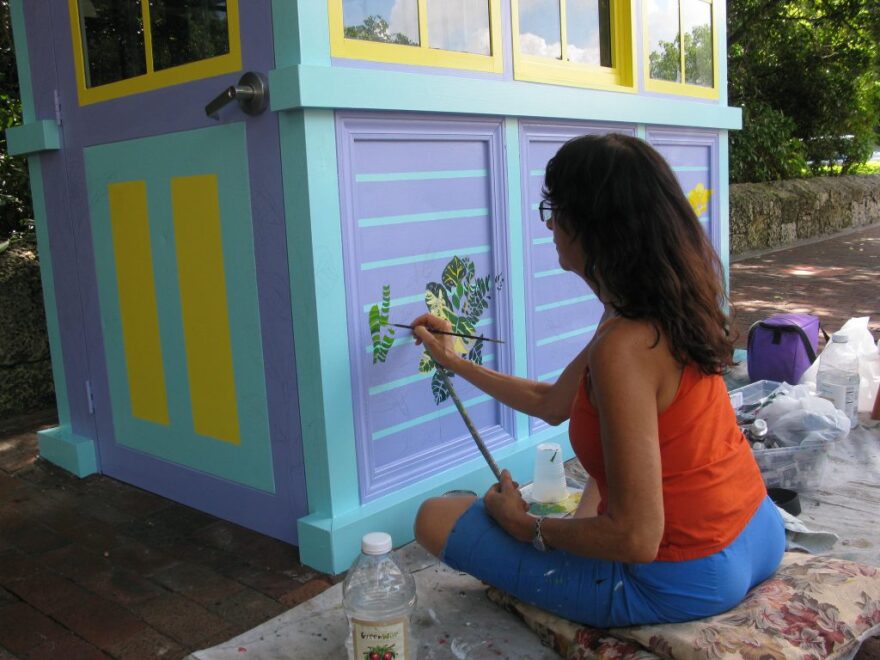 Artist Eileen Seitz was recruited to add a splash of color and tropical flair to the three information booths in the Grove.