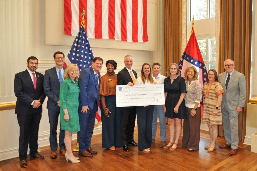 Arkansas Governor Sarah Huckabee Sanders awarded New York Institute of Technology College of Osteopathic Medicine at Arkansas State University with a $1.5 million grant Thursday to be used for a maternal health initiative in Mississippi and Poinsett Counties. Pictured are (L to R) Arkansas Rural Health Transformation Director Brad Nye; Arkansas State Crime Lab Director Dr. Ted Brown; Arkansas Surgeon General Dr. Kay Chandler; NYITCOM at A-State representatives Casey Pearce, Dr. Brookshield Laurent, and NYITCOM at A-State Dean Dr. Shane Speights; Gov. Sanders; NYITCOM at A-State's Sara Walker and Dr. Amanda Deel; Arkansas Secretary of Health Renee Mallory; Secretary of Human Services Janet Mann; and Secretary of the Finance and Administration Jim Hudson.