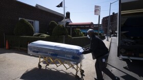 On Friday, March 27, 2020, William Samuels delivers caskets to the Gerard Neufeld Funeral Home during the coronavirus pandemic in the Queens borough of New York. 