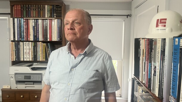 Daniel Boucher near the window in his home where he first saw ICE agents on Pool St. in Biddeford.