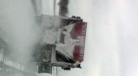 Snow plow works Highway 169 near 91st Street.