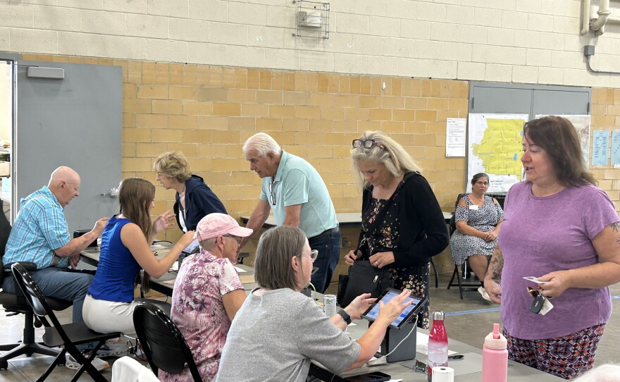 Election judges check voters in Aug. 11, 2026, in Hibbing. City Clerk Candie Seppala says between 48 and 50 volunteers are required to work the city's polls each election. The midterm primary volunteers included eight newcomers.