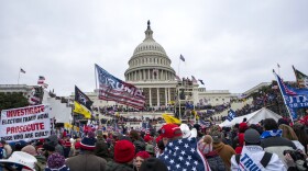 FILE - Insurrections loyal to President Donald Trump rally at the U.S. Capitol in Washington on Jan. 6, 2021. A Maryland police officer who fatally shot a stabbing suspect earlier this year was arrested Thursday, Oct. 19, 2023, on charges that he assaulted police during a mob's Jan. 6, 2021, attack on the U.S. Capitol. The Montgomery County Police Department said in a news release that it has suspended Officer Justin Lee without pay and is "taking steps to terminate his employment" after his indictment on felony charges. (AP Photo/Jose Luis Magana, File)