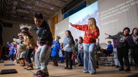 Audience members join Upallret on the Cama'i stage on March 29, 2026 in Bethel, Alaska.
