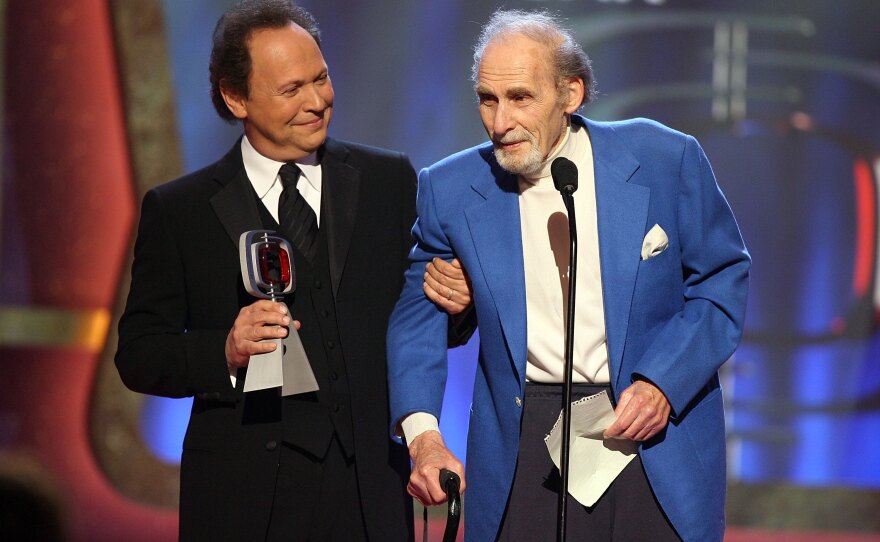 Actor Billy Crystal presents the Pioneer Award to Caesar onstage at the 2006 TV Land Awards, March 19, 2006, in Santa Monica, Calif.