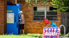 A voter at Joslin Elementary during the primary runoff elections in July.