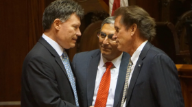 Sen. Len Fasano watches Sens. John Fonfara and Scott Frantz, the Democratic and Republican finance co-chairs, celebrate the landmark budget vote in 2017.