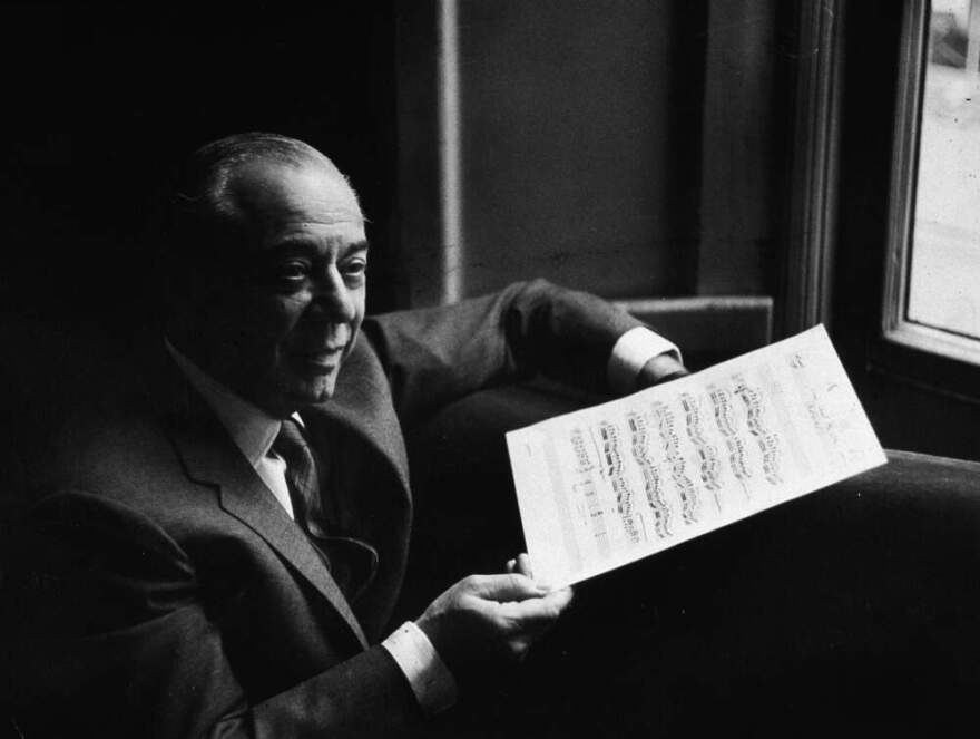 American composer Richard Rodgers (1902 - 1979) smiles and holds a musical score while in rehearsal for the musical, 'The Boys From Syracuse,' written with lyricist Lorenz Hart, London, England, circa 1965. (Express Newspapers/Getty Images)