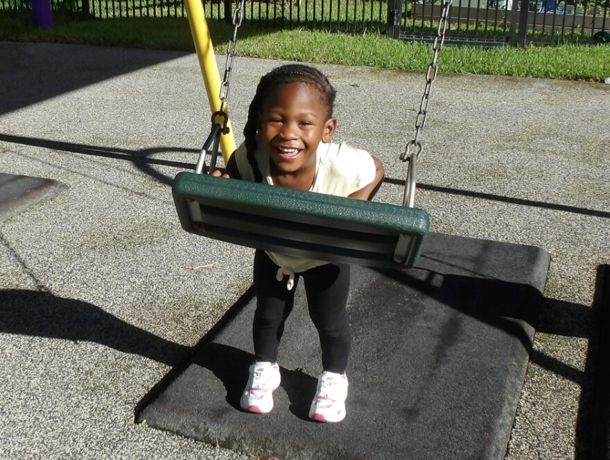 A child plays on the swings in the outdoor playground at Children First in Sarasota on Sept. 9, 2026.
