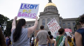 People gather in front of the Georgia State Capital in Atlanta, Friday, June 24, 2022, to protest the Supreme Court decision striking down Roe v. Wade (AP Photo/Ben Gray)