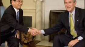 President George W. Bush, right, shakes hands with the President of Vietnam, Nguyen Minh Triet in the Oval Office at the White House.