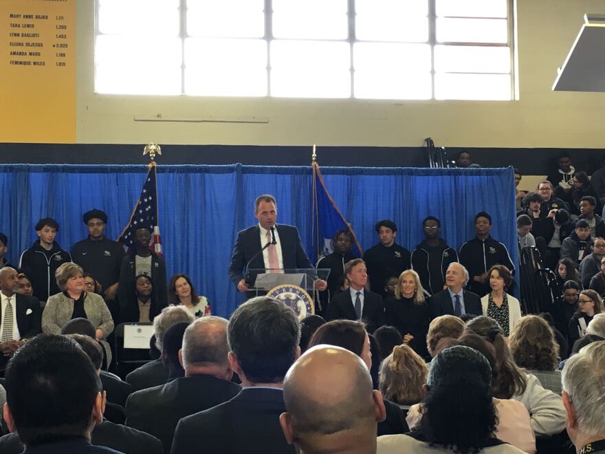 East Hartford Superintendent Nathan Quesnel speaks at the announcement Friday April 5, watched by Governor Ned Lamont and Ray and Barbara Dalio.