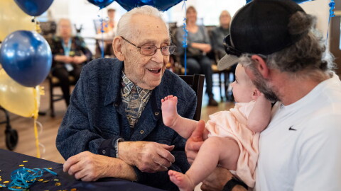 Beryl Dillman, 108, greets his newest great-grandchild Bella Rose Sturges at his birthday celebration on Oct. 1, 2026 in Eugene, Ore. Dillman's family believes he could be the oldest living man in the state of Oregon.