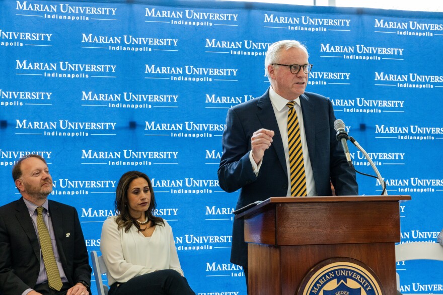 A man stands at a podium.