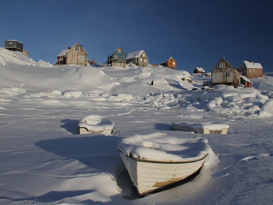 Ice-bound fishing boats in the harbor at Tiniteqilaaq, Greenland. Only about 50 people live in what was once a great hunting community.