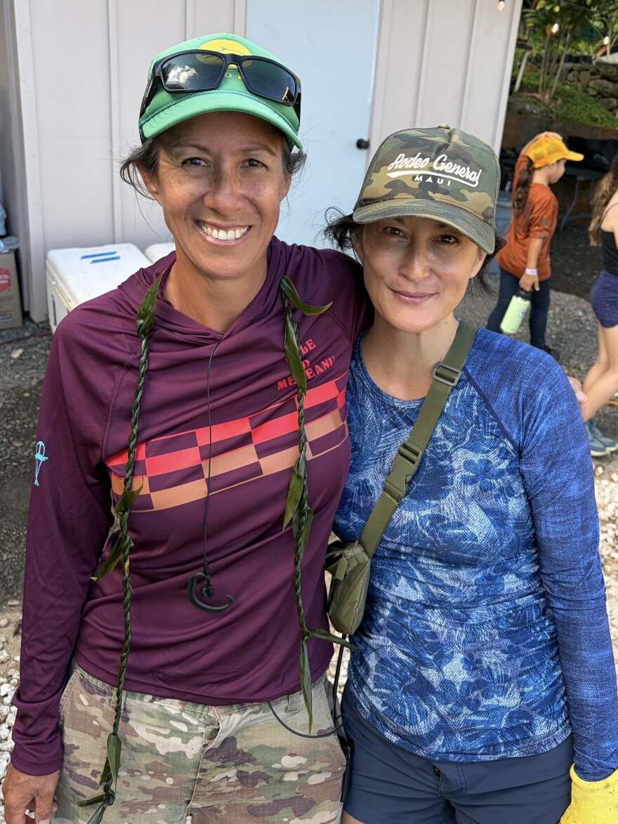 Hi‘ilei Kawelo of Paepae o Heʻeia, left, and writer Carrie Ching, right, at the fishpond in Heʻeia.