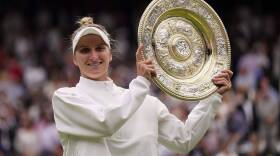 Czech Republic's Marketa Vondrousova celebrates with the trophy after beating Tunisia's Ons Jabeur to win the final of the women's singles on day thirteen of the Wimbledon tennis championships. (Alberto Pezzali/AP)