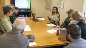(Top right) Rebecca Hoffman, Monument Ranger, and her staff discuss daily tasks during a staff meeting at Mount St. Helens National Volcanic Monument office, Gifford Pinchot National Forest, Washington.