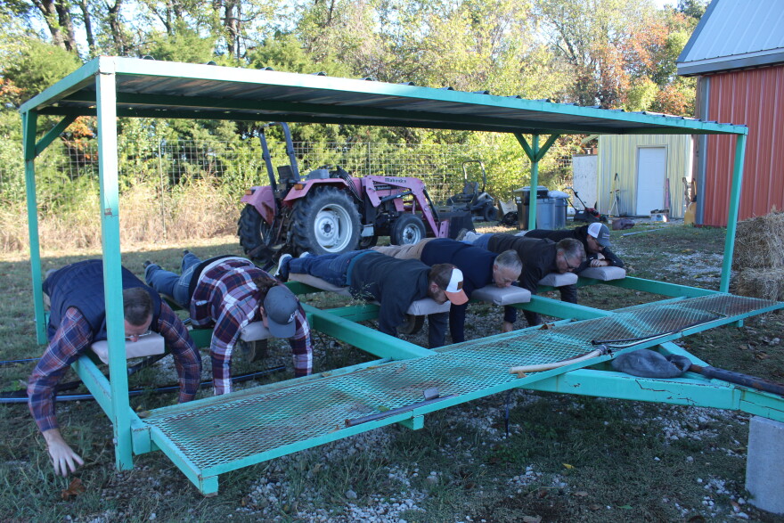 Members of the Greene County Commission and others try out a piece of equipment at Tasty Acres Farm in Springfield, Mo. on October 26, 2026.
