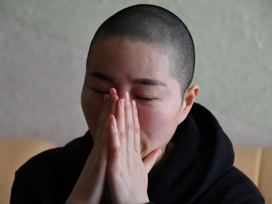 Li Wenzu, the wife of imprisoned lawyer Wang Quanzhang, reacts before an interview at her home in Beijing. Wang, a prominent Chinese human rights lawyer, was sentenced on Jan. 28 to 4 1/2 years in prison for state subversion.