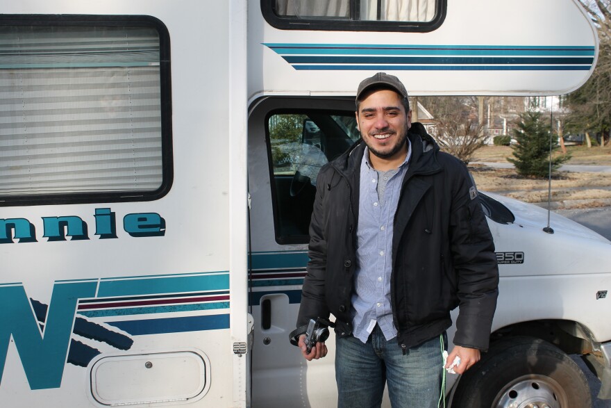 Lebanese photographer Fadi BouKaram is traveling across the U.S. visiting every town that shares the name of homeland. Here he is pictured in front of his 21-foot RV.