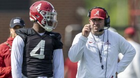 Alabama offensive coordinator Nick Sheridan coaches quarterback Jalen Milroe (4) during NCAA college football practice, Wednesday, July 31, 2024, at the Thomas-Drew Practice Fields in Tuscaloosa, Ala. (AP Photo/Vasha Hunt)