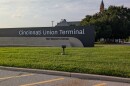 An outdoor marquee for Cincinnati's Union Terminal on a grassy strip.
