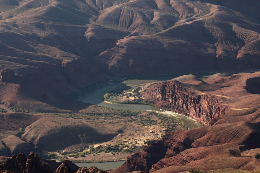 The Colorado River flows through the Grand Canyon in northern Arizona on June 16, 2026. New rules for managing its water become official on Oct. 1, 2026, but Arizona, California and Nevada are still negotiating a deal to spread out the impact of cutbacks.