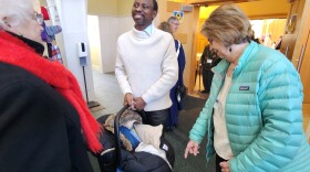 Makengo Nzeza at church with his baby