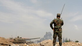 A soldier in Syria's President Bashar al-Assad forces near the Yarmouk Palestinian camp in Damascus. Syria's government captured at least two villages from U.S.-backed Syrian Democratic Forces east of the Euphrates River near the border with Iraq.