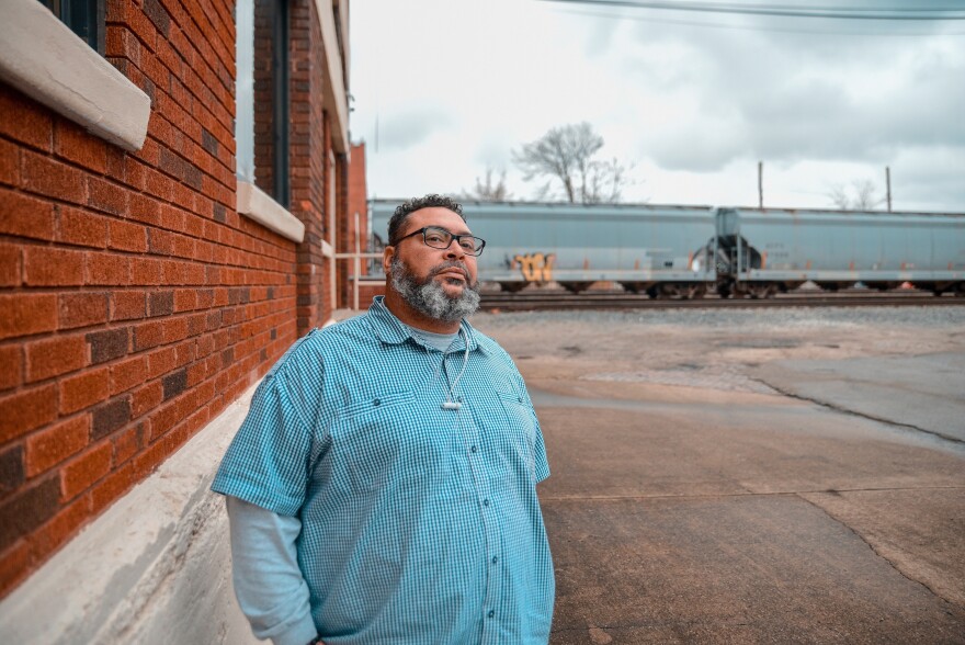 Thommy Hill stands outside the Cabell County/Huntington Health Department, where he works in the harm reduction program, in Huntington, W.Va., on Wednesday, Dec. 5, 2018. The former drug dealer has become its gatekeeper and central cog in the program.