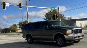 An SUV travels through the new intersection of Freedom Parkway and North Cummings Lane Tuesday.