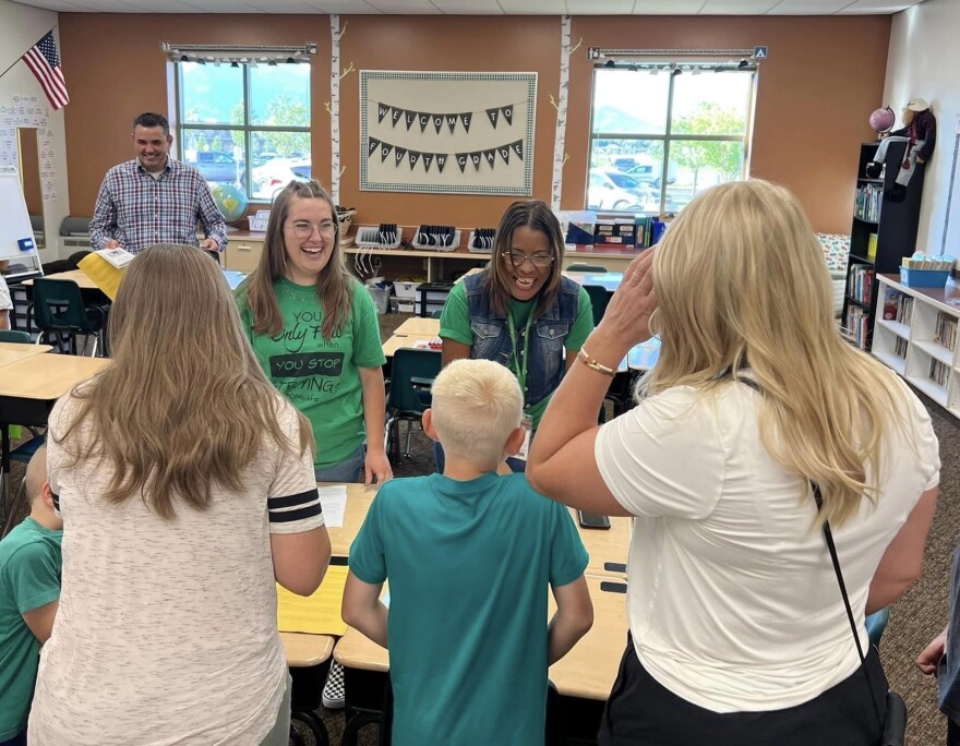 Old Mill Elementary School teachers Emily Geilman (L) and Maria Rivera speak to students and parents.