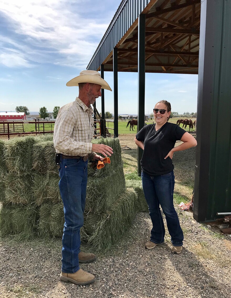 Yellowstone County Extension Agent Callie Cooley chats with hay producer Dan Sloan after inspecting his field for the Certified Noxious Weed Seed Free Forage Program