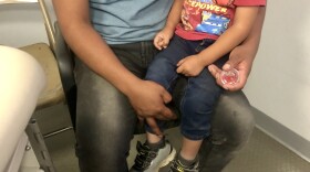 Sergio, a Guatemalan migrant, recently visited a mobile medical van with his 2-year-old son, Dylan. Sergio thinks his son became sick in a holding facility, where they spent two days.