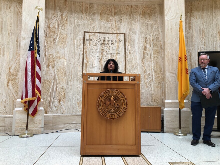 Secretary Sarita Nair speaks at the Roundhouse to urge people who have lost jobs with federal agencies or contractors to apply for unemployment