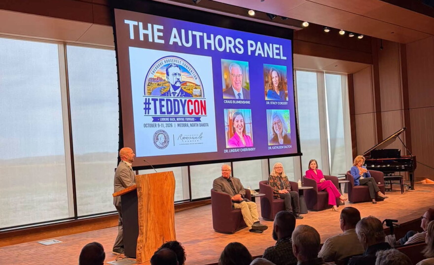 Michael Patrick Cullinane introduces moderator Craig Blumenshine and historians Kathleen Dalton, Lindsay Chervinsky and Stacy Cordery at the Theodore Roosevelt Presidential Library during TeddyCon on Friday, Oct. 9, 2026.