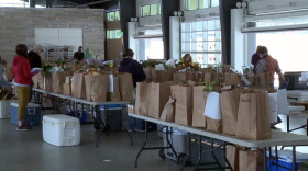 Volunteers prepared produce and delivered them to each patron's vehicle.