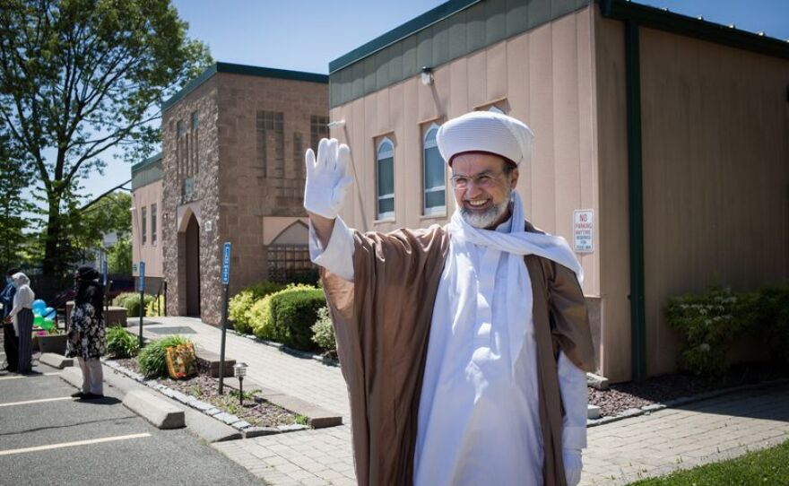 Imam Wissam Abdul-Beki greets worshipers