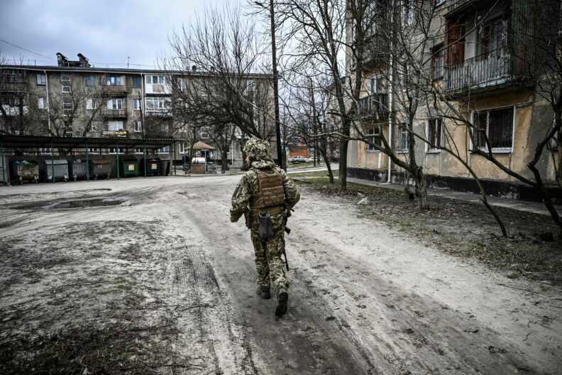 A Ukraine army soldier walks in the town of Schastia, near the eastern Ukraine city of Lugansk a day after Russia recognised east Ukraine's separatist republics and ordered the Russian army to send troops there as "peacekeepers."