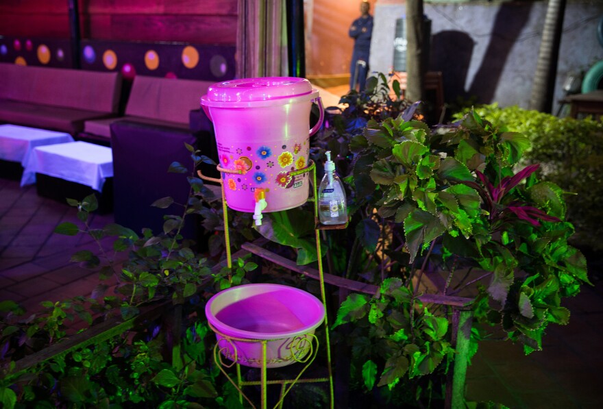 A hand-washing station outside the Ibiza dance club. To help keep the Ebola outbreak in check, guests are required to wash their hands before entering.