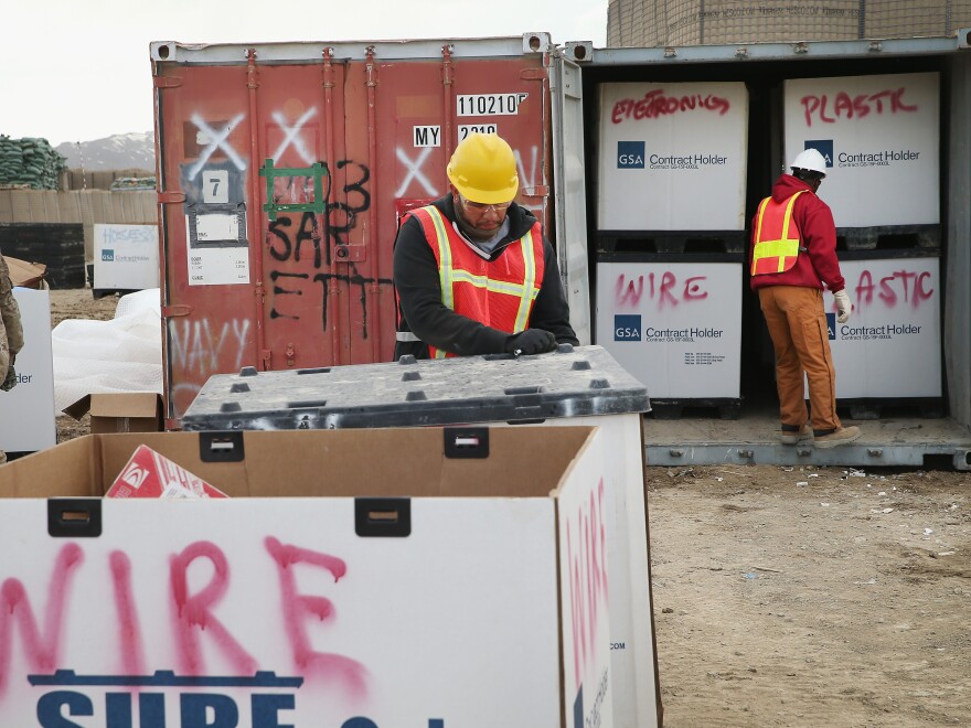 A shipping container is filled with excess equipment and supplies in March as the U.S. military draws down in Afghanistan.