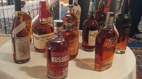 Bourbon bottles were used as decorations for the Kentucky's Edge announcement.